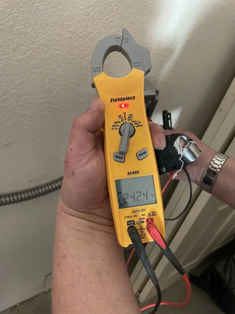Voltage testing with clamp meter during Generator Installation in Centennial